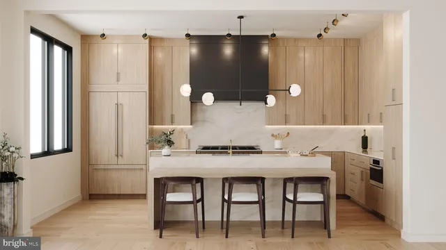 a kitchen with a table and chairs