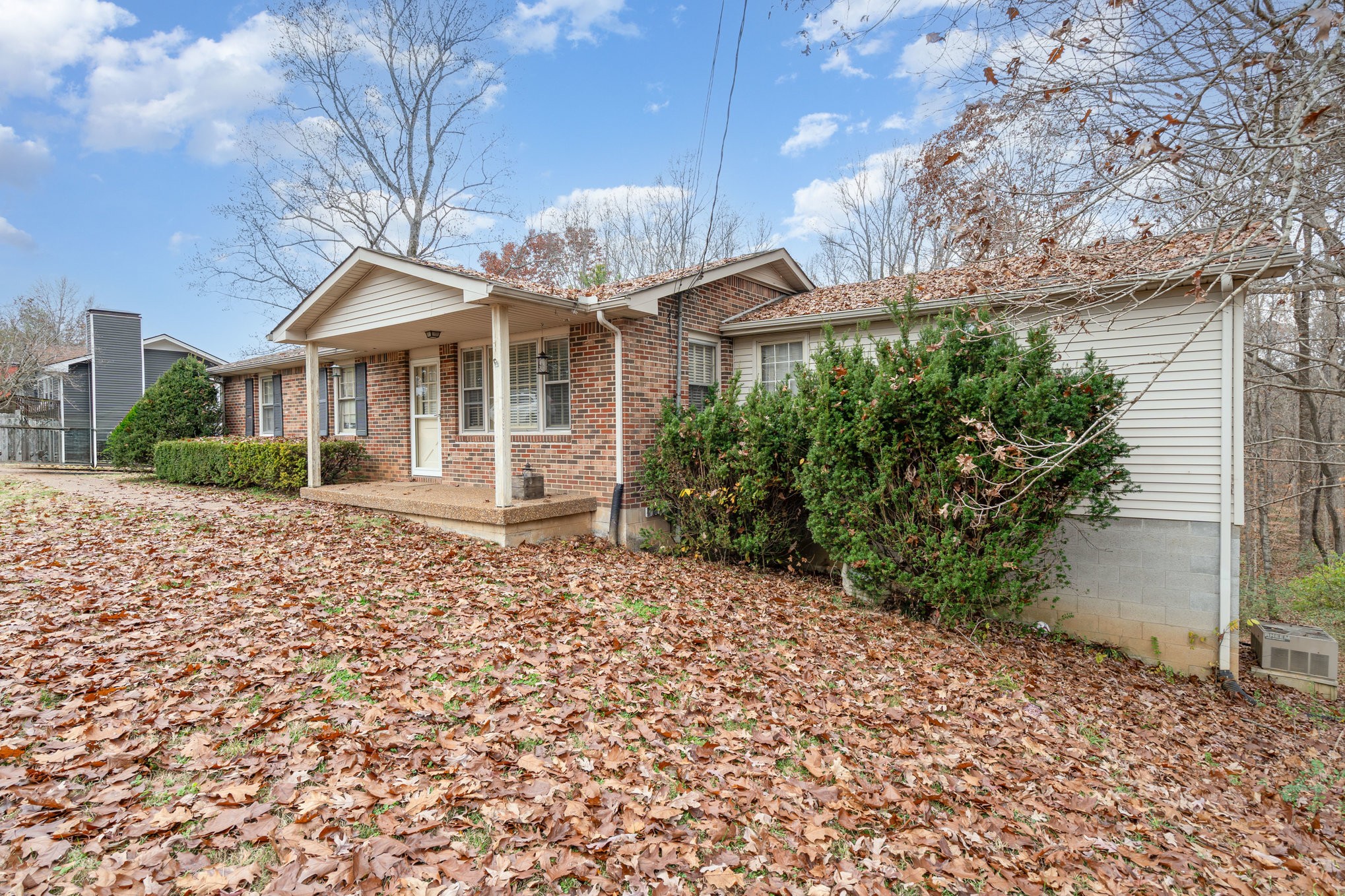 1176 Petty Road White Bluff, TN 37187 - Photo 2 of 23 a front view of a house with a garden