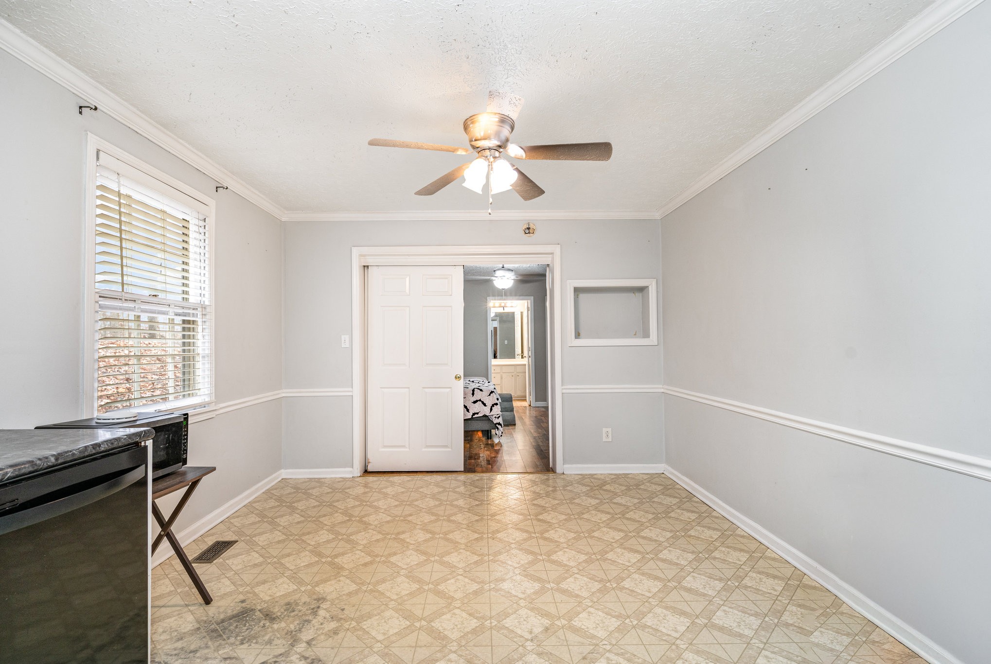 1176 Petty Road White Bluff, TN 37187 - Photo 9 of 23 a view of a livingroom with wooden floor and a ceiling fan
