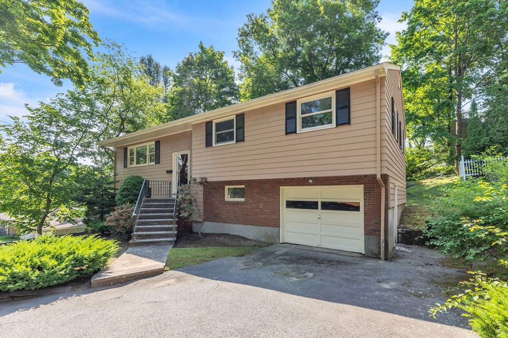 4 Birch Road Swampscott, MA 01907 - Photo 2 of 42 a front view of a house with a garden