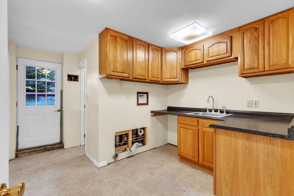 4 Birch Road Swampscott, MA 01907 - Photo 26 of 42 a kitchen with stainless steel appliances granite countertop a stove a sink and a refrigerator