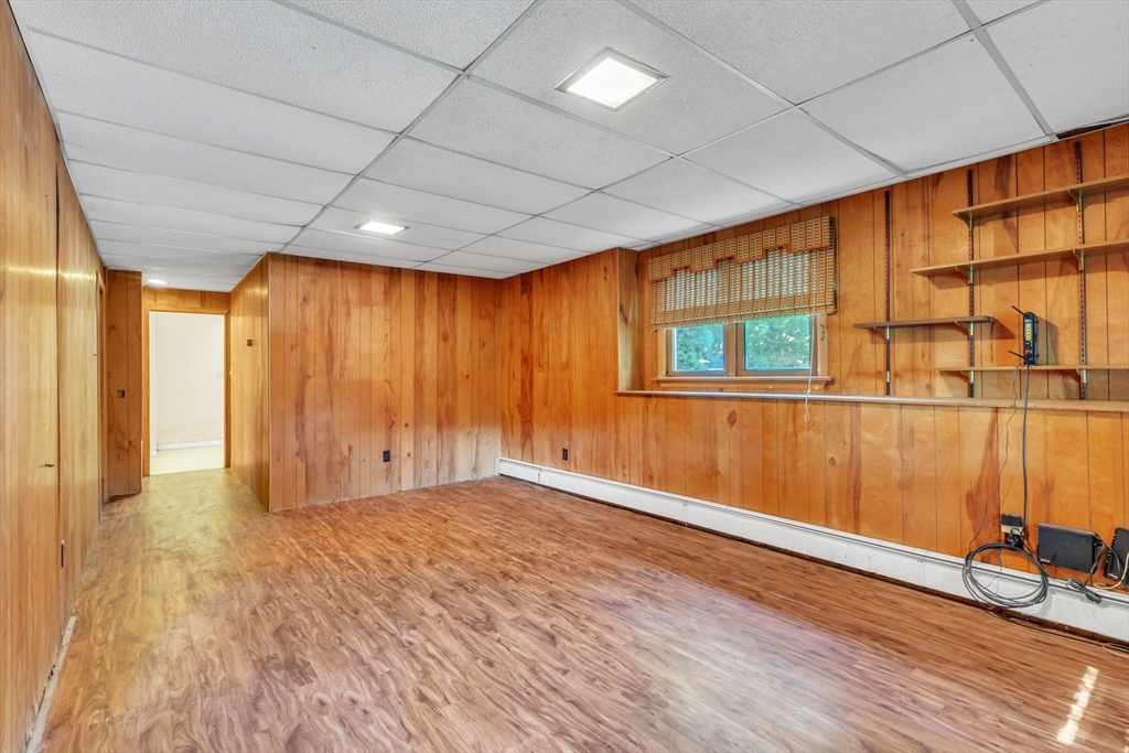 4 Birch Road Swampscott, MA 01907 - Photo 30 of 42 a view of an empty room with wooden floor and a window