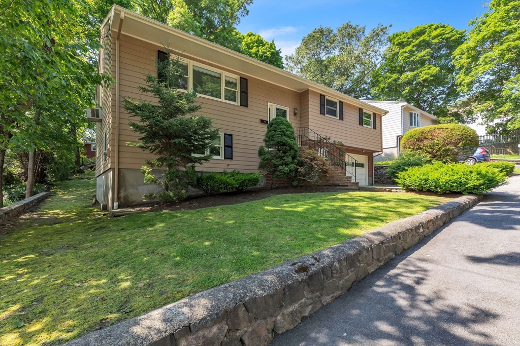 4 Birch Road Swampscott, MA 01907 - Photo 3 of 42 a view of a yard with a house and a garden
