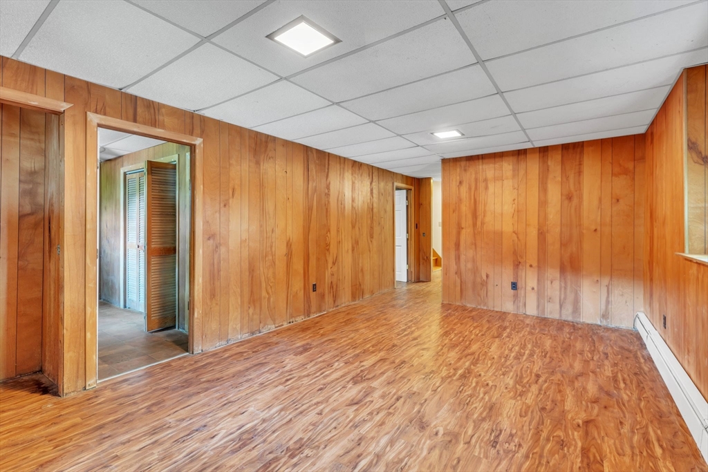 4 Birch Road Swampscott, MA 01907 - Photo 31 of 42 a view of an empty room with wooden floor and a window