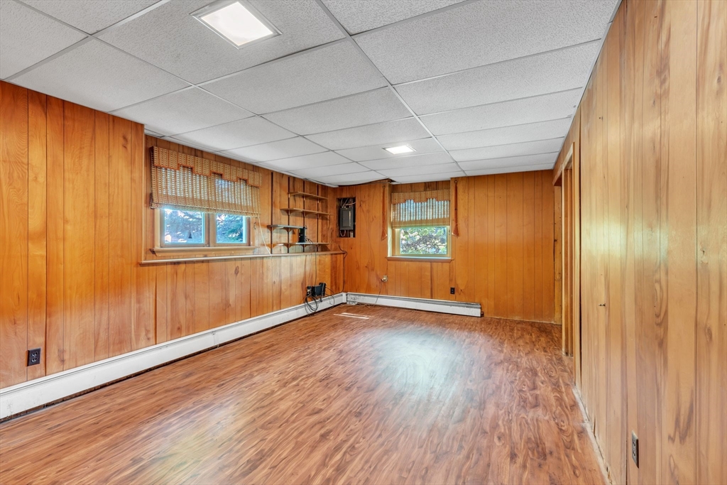 4 Birch Road Swampscott, MA 01907 - Photo 32 of 42 an empty room with wooden floor and windows
