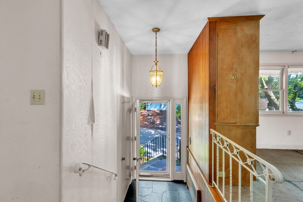 4 Birch Road Swampscott, MA 01907 - Photo 5 of 42 a view of a hallway with wooden floor and staircase