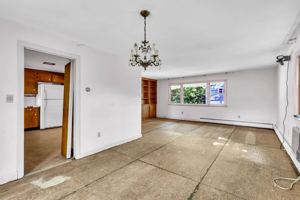 4 Birch Road Swampscott, MA 01907 - Photo 10 of 42 a view of a room with a chandelier fan and windows