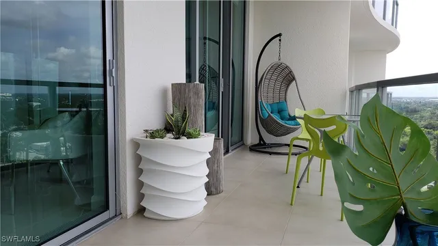 a view of dining room and floor to ceiling window and wooden floor