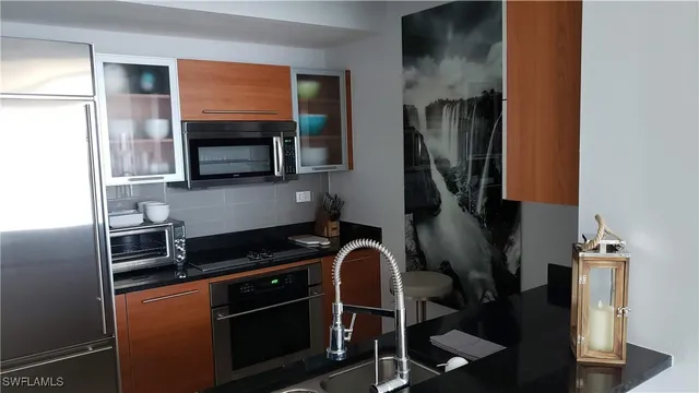 a kitchen with a stove and a microwave