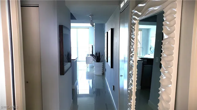 a view of a hallway with a dining area