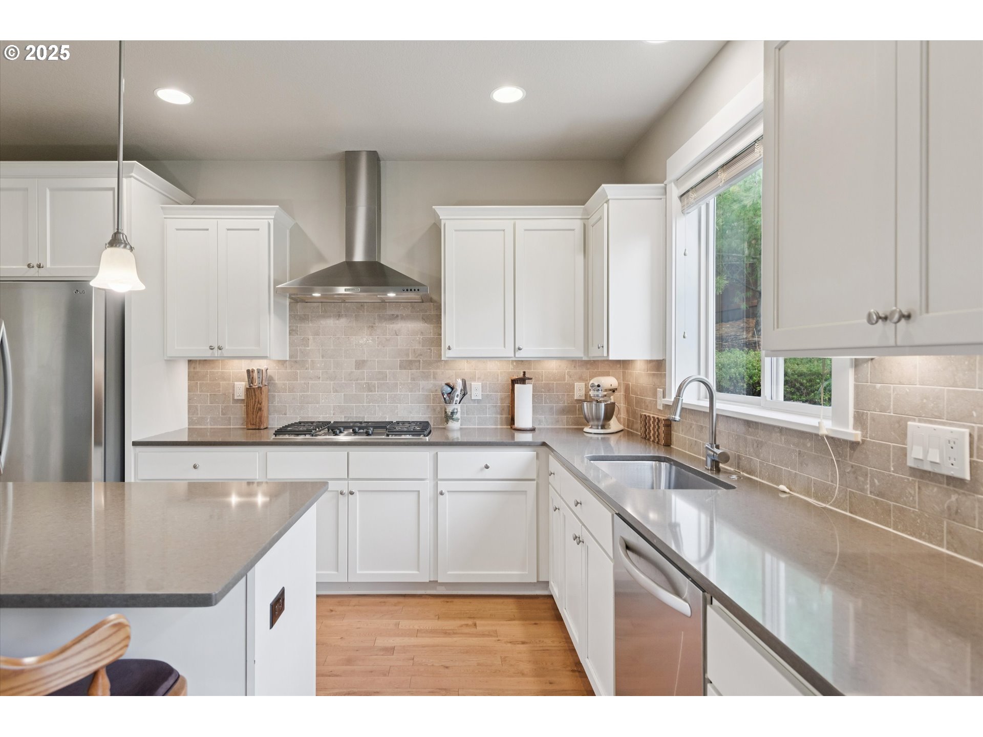 3041 Winkel Way West Linn, OR 97068 - Photo 14 of 45 a kitchen with stainless steel appliances granite countertop a sink a stove and a wooden floors