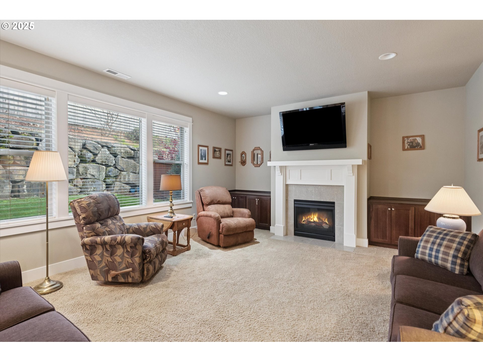 3041 Winkel Way West Linn, OR 97068 - Photo 5 of 45 a living room with furniture a flat screen tv and a fireplace