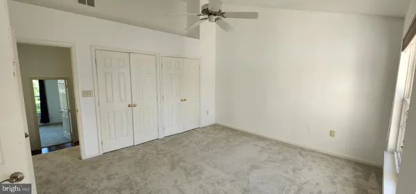 an empty room with closet area