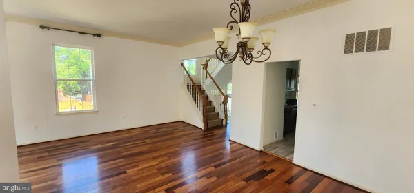 a view of an entryway with wooden floor