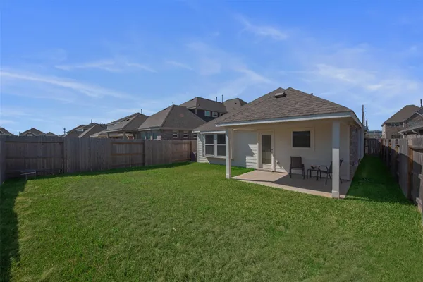 a front view of a house with garden and porch
