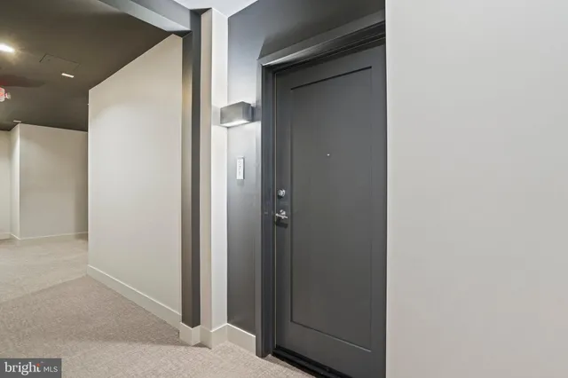 a view of a storage and utility room with washer and dryer