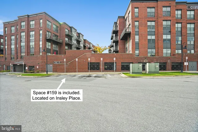 a view of a hall way with furniture