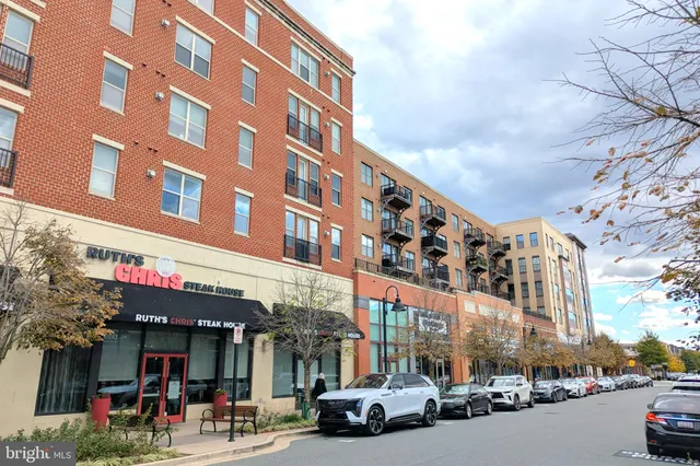 a front view of a building with retail shops