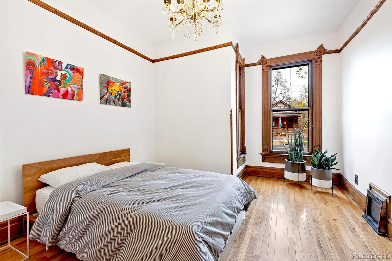 2851 Perry Street Denver, CO 80212 - Photo 21 of 50 a bedroom with a bed and a large window