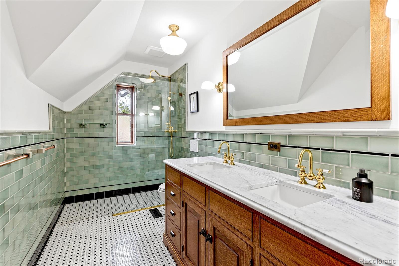 2851 Perry Street Denver, CO 80212 - Photo 39 of 50 a bathroom with a sink and a mirror