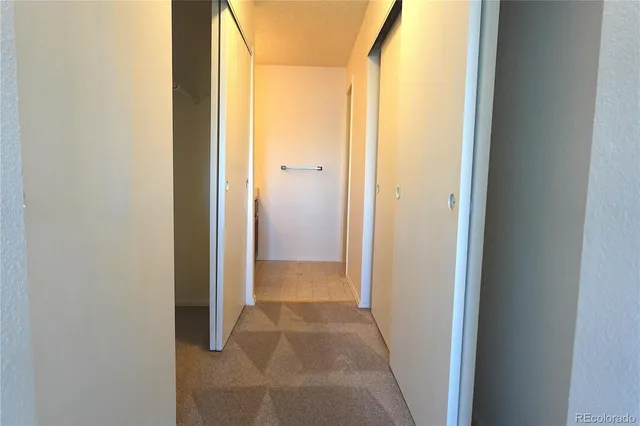 a bathroom with a toilet and shower