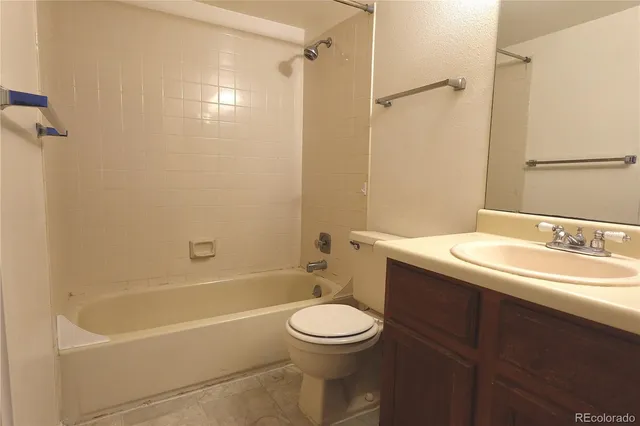 a view of a swimming pool with lawn chairs under an umbrella