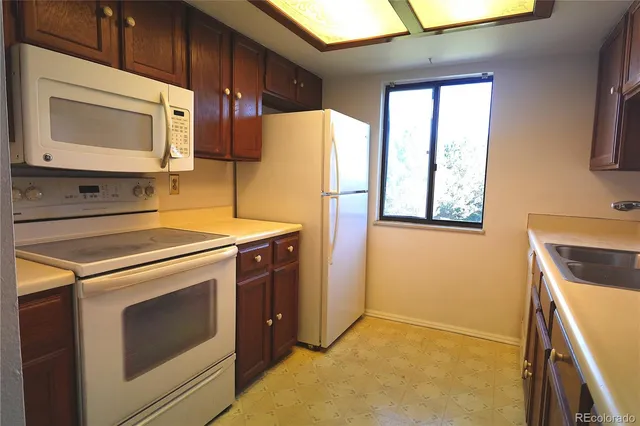 a kitchen with a stove microwave and refrigerator