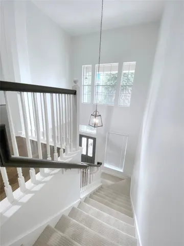 a view of entryway and hall with a bath tub