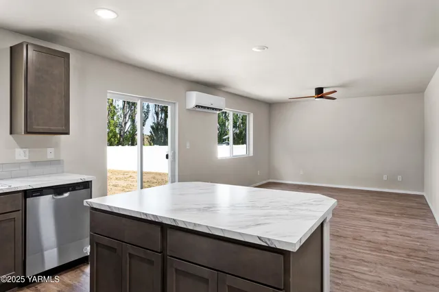 a kitchen with a sink and a window