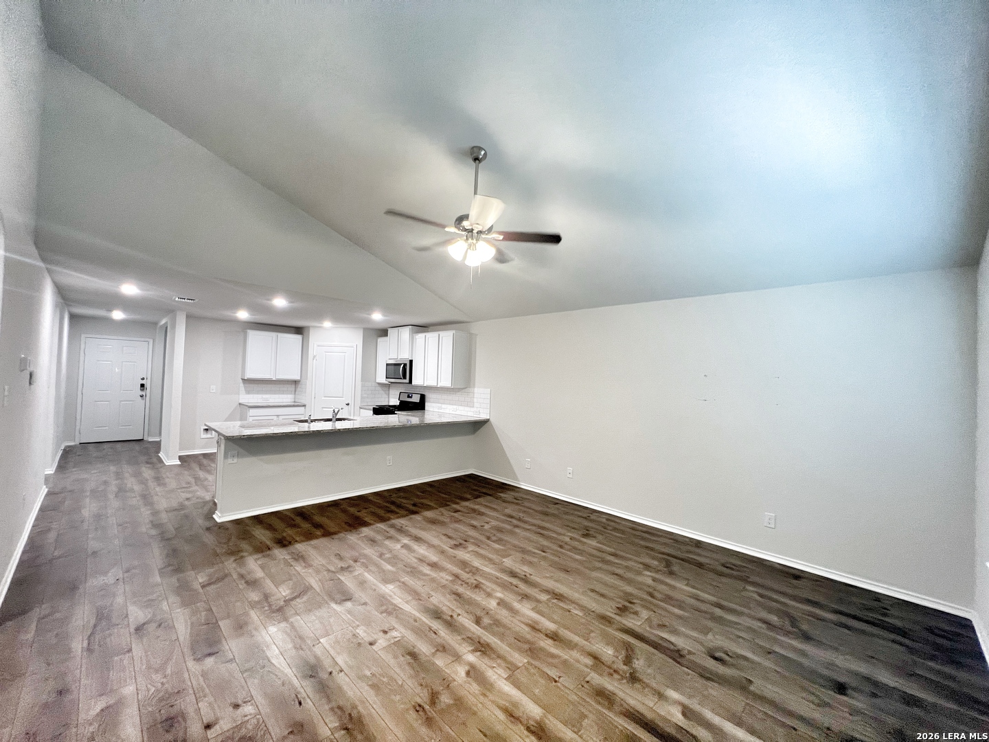 29529 Spring Copper Bulverde, TX 78163 - Photo 14 of 41 a large kitchen with a lot of counter space and wooden floor