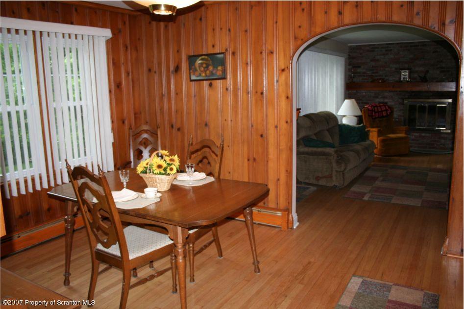 181 Falls Road Falls, PA 18615 - Photo 14 of 16 a view of a dining table and chairs in the patio