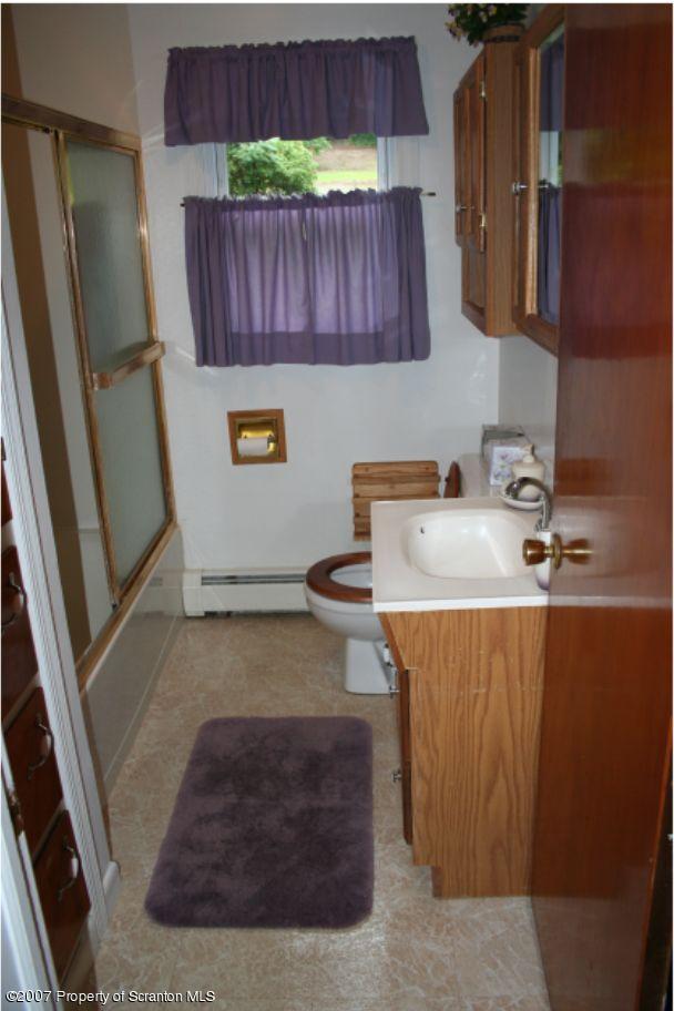 181 Falls Road Falls, PA 18615 - Photo 15 of 16 a kitchen with a sink and a refrigerator