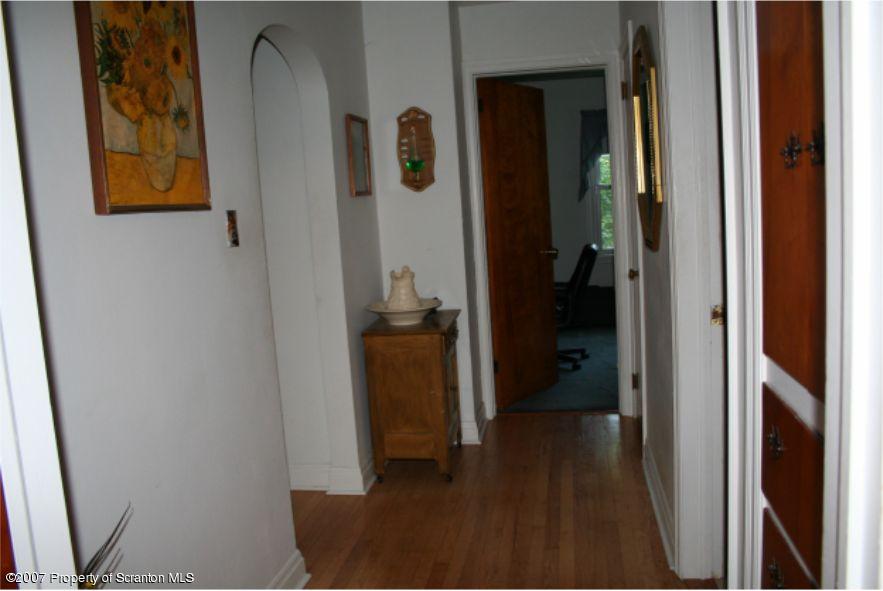 181 Falls Road Falls, PA 18615 - Photo 4 of 16 a view of a hallway with wooden floor and closet