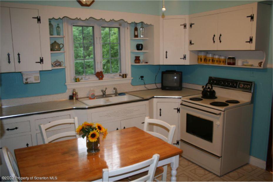 181 Falls Road Falls, PA 18615 - Photo 5 of 16 a kitchen with stainless steel appliances granite countertop a stove a sink and a microwave