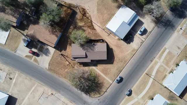 an aerial view of a house with stairs