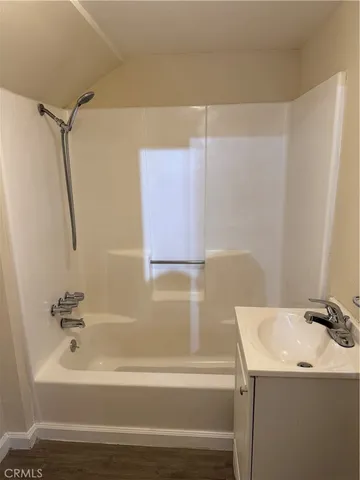 a bathroom with a sink a mirror and a bathtub