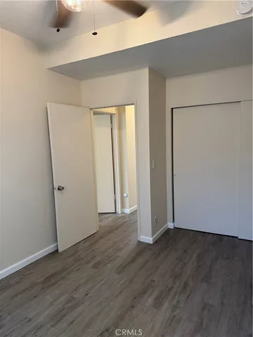 an empty room with wooden floor