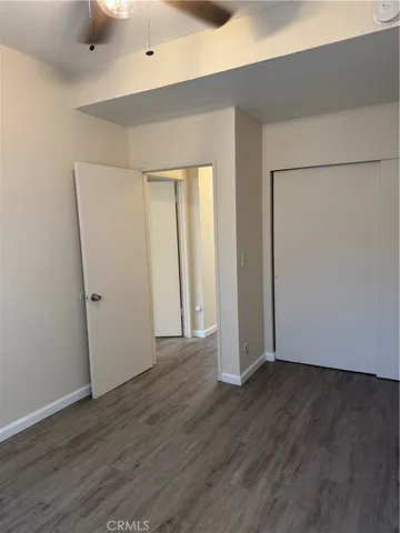 an empty room with wooden floor