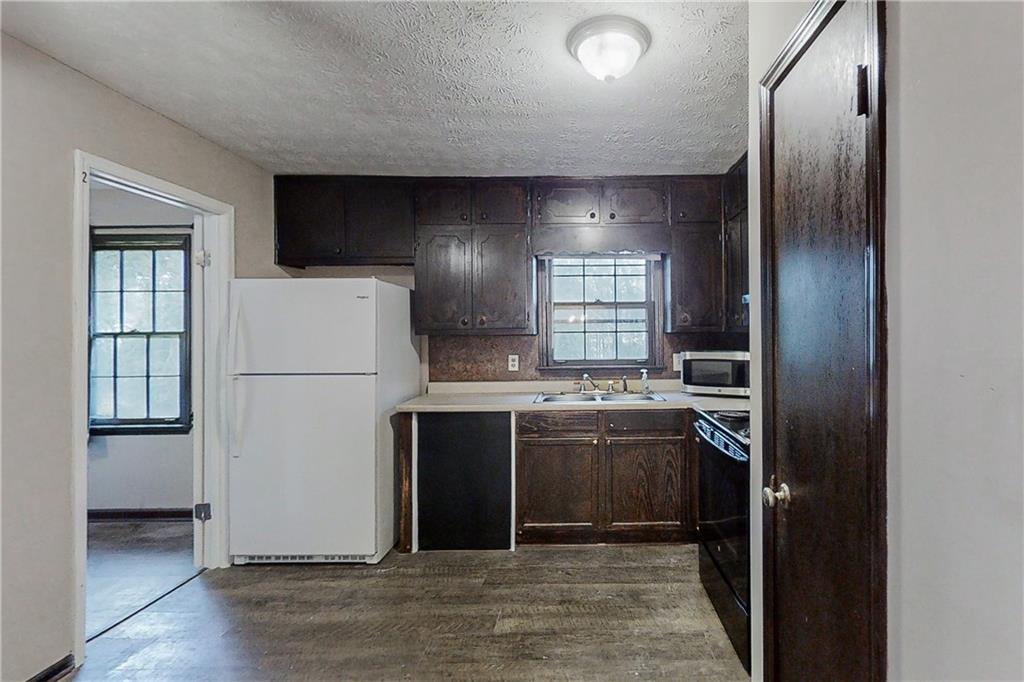 2284 Emerald Springs Drive Decatur, GA 30035 - Photo 2 of 30 a kitchen with a refrigerator and window