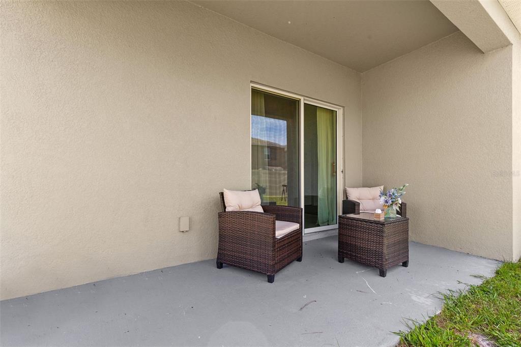 2959 Common Fig Run Wesley Chapel, FL 33543 - Photo 17 of 36 a living room with furniture and a window
