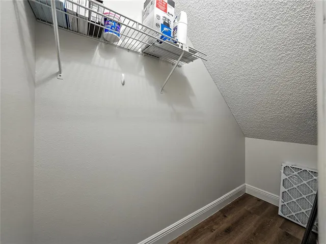 a view of staircase with white walls