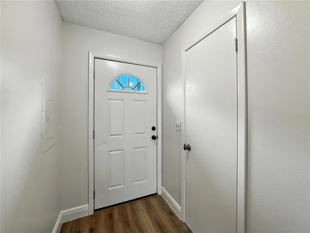 a bathroom with a toilet a sink and a mirror