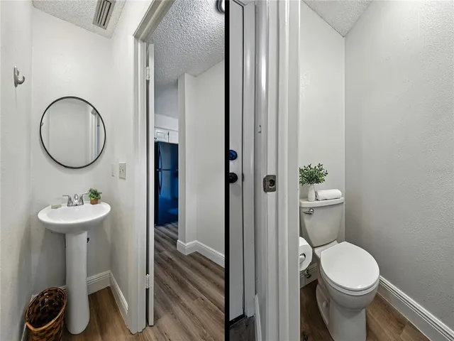 a kitchen with stainless steel appliances granite countertop a refrigerator stove top oven and sink