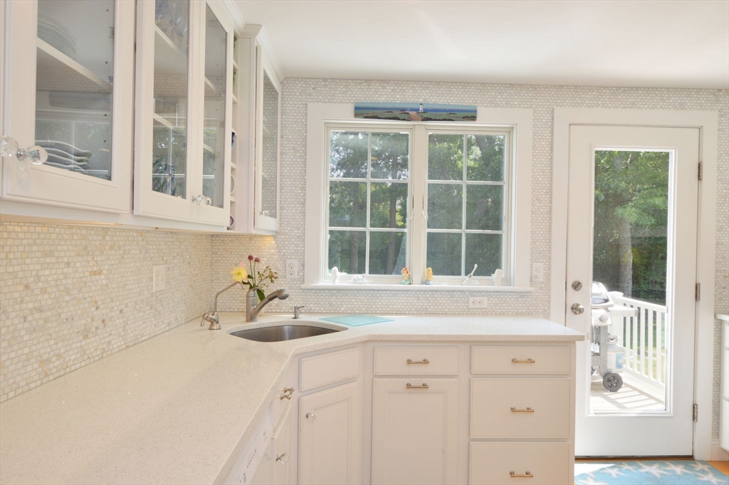 47 Great Bay Road Osterville, MA 02655 - Photo 16 of 38 a bathroom with a sink and a window