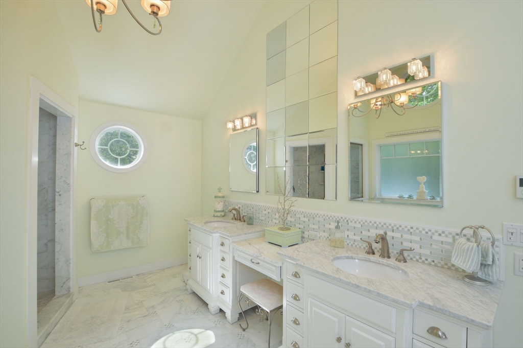 47 Great Bay Road Osterville, MA 02655 - Photo 21 of 38 a bathroom with a double vanity sink and a mirror