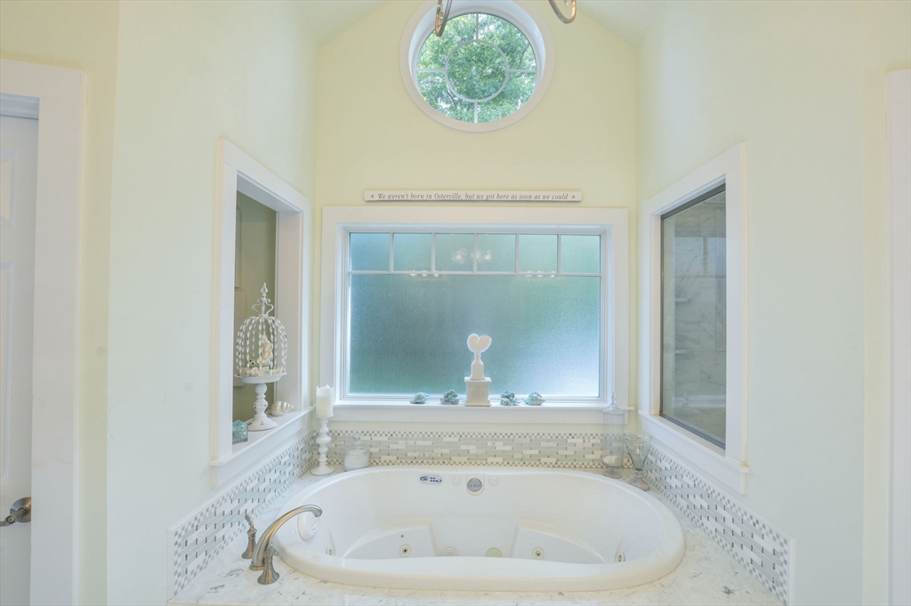 47 Great Bay Road Osterville, MA 02655 - Photo 22 of 38 a bathroom with a bathtub and a window