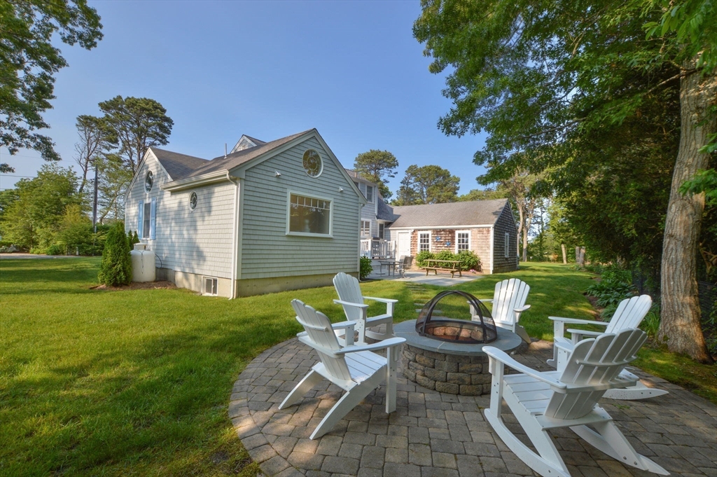 47 Great Bay Road Osterville, MA 02655 - Photo 30 of 38 a view of a house with backyard sitting area and garden