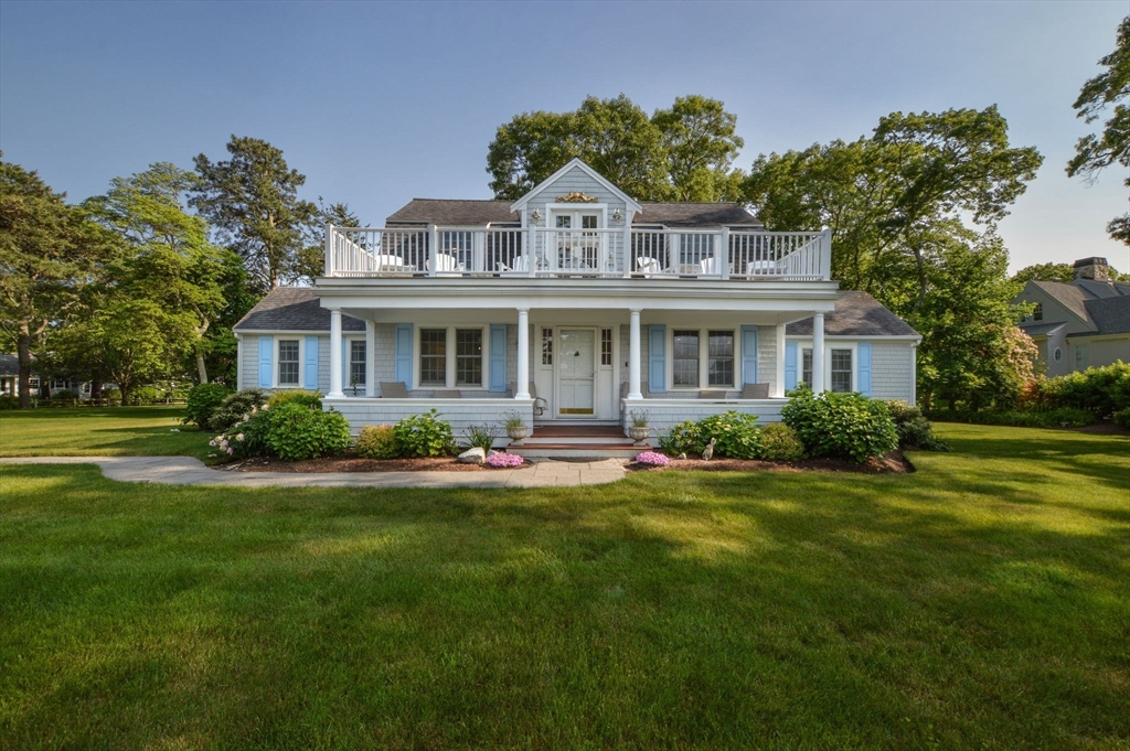 47 Great Bay Road Osterville, MA 02655 - Photo 3 of 38 a front view of a house with a yard
