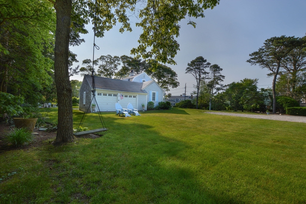 47 Great Bay Road Osterville, MA 02655 - Photo 31 of 38 a front view of a house with garden