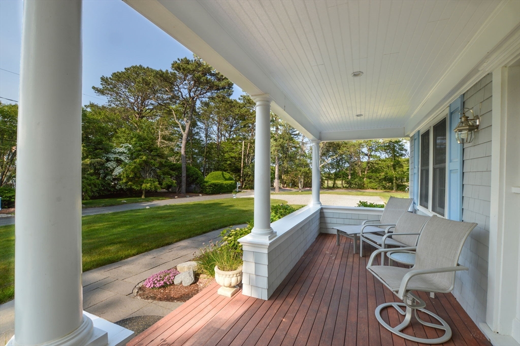 47 Great Bay Road Osterville, MA 02655 - Photo 7 of 38 a view of a porch with furniture and garden